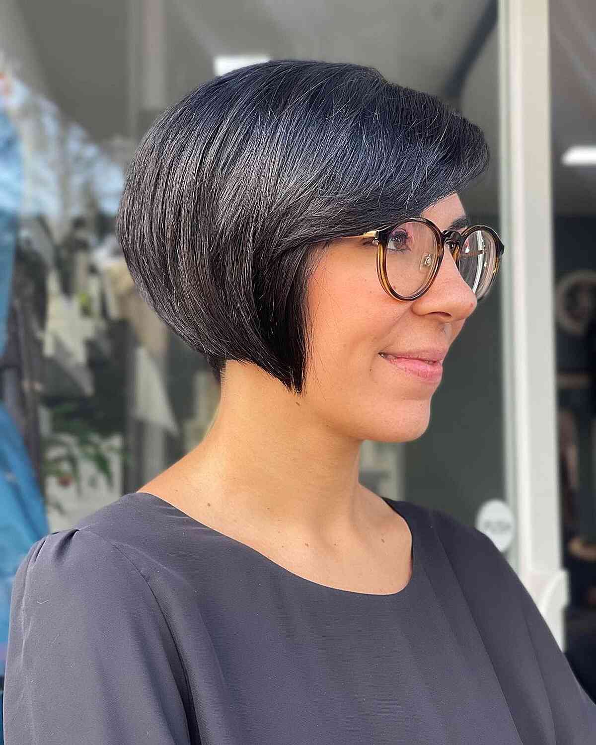 Short Black Round Bob with Side-Swept Bangs for Women Wearing Glasses