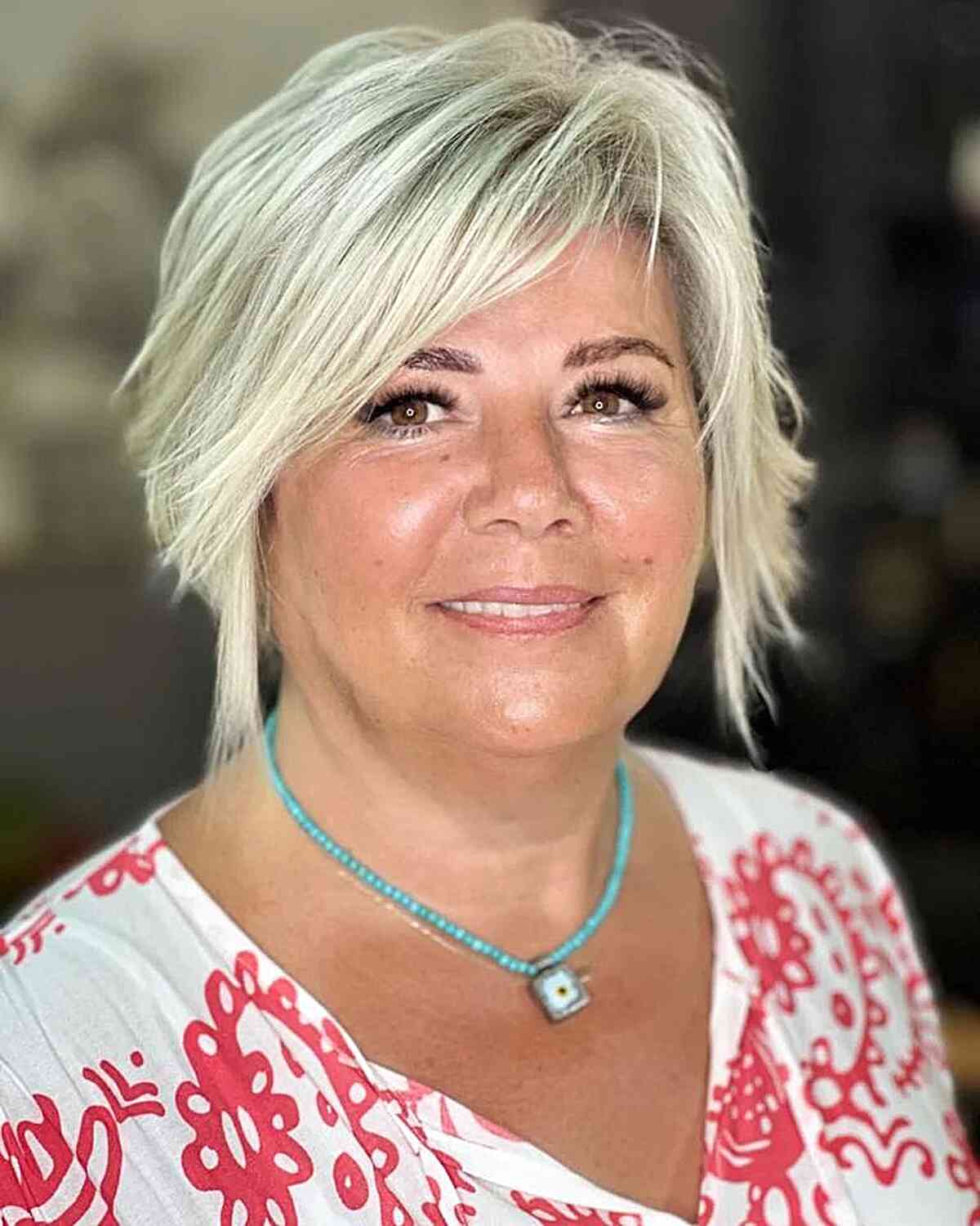 Short Bleached Blonde Bob with Choppy Layers for Ladies Aged 50