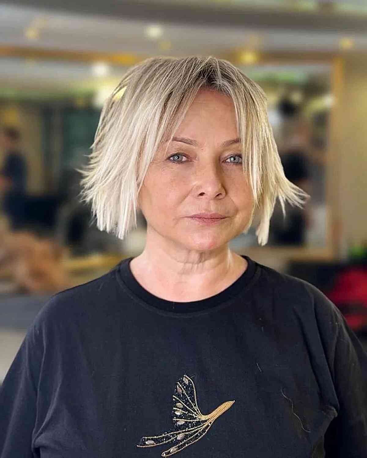 Short Blonde Bob with Flicked-Out Ends for 50-year-olds