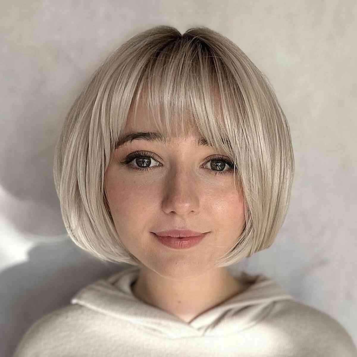 Short Blonde French Bob with Fringe for girls in their 20s with style