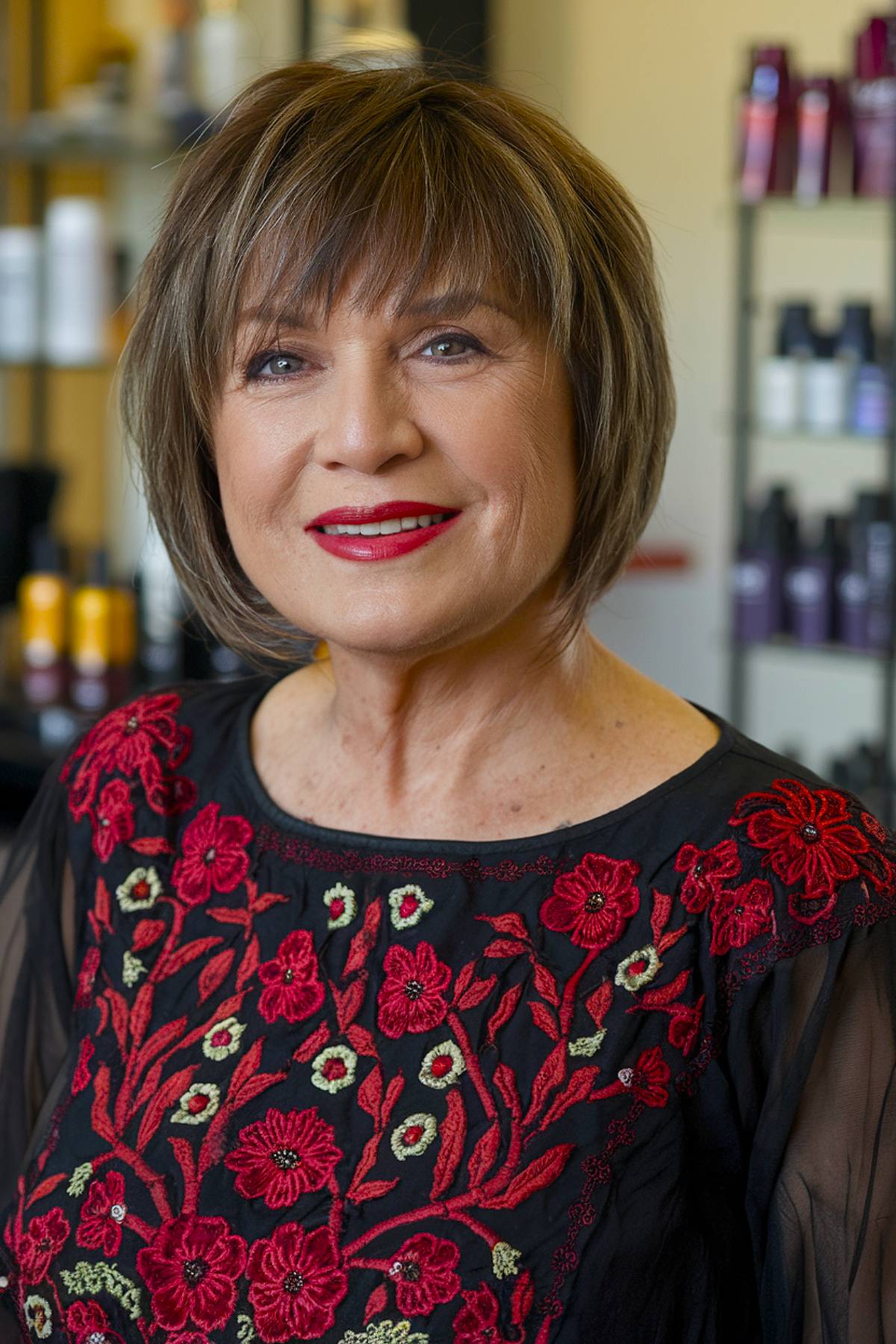 A short bob for plus-size older women, featuring soft layers and bangs that frame the face beautifully