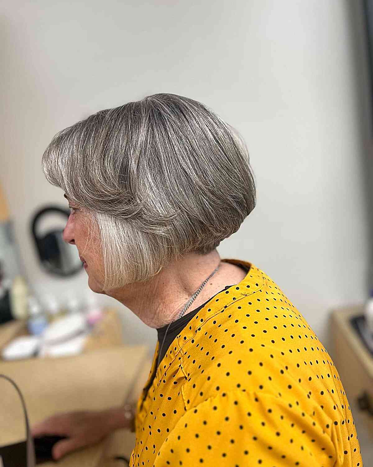 Short Bob Hair with Feathered Bangs on Older Ladies Over 70 Grey Hair