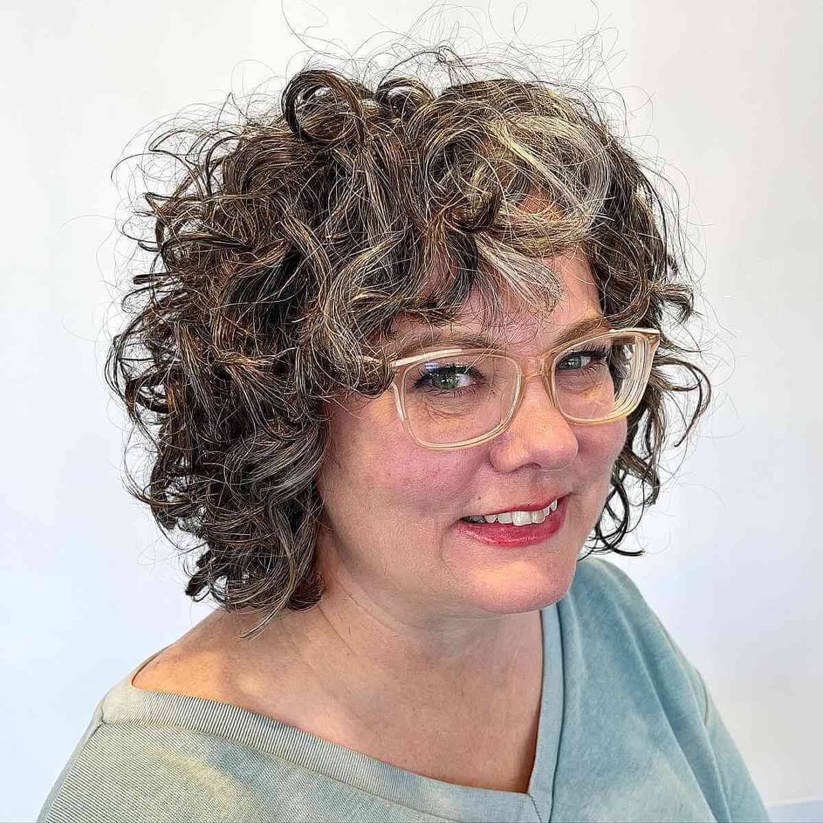 Short Bob with Bangs on Curly Hair for Ladies in Their 40s