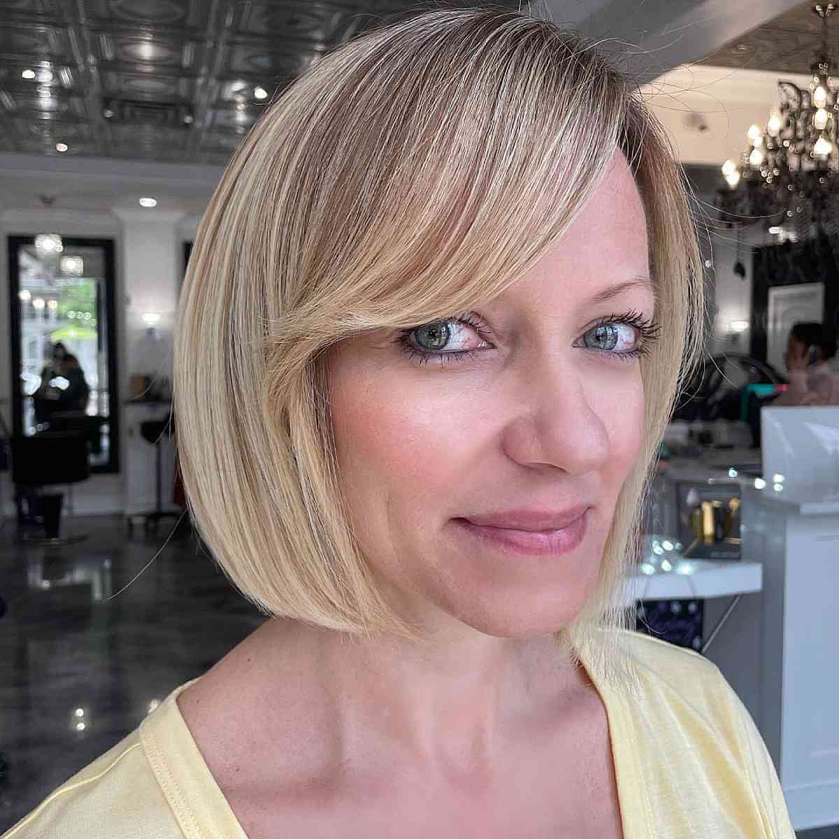 Short Chic Blonde Bob with Side-Swept Bangs