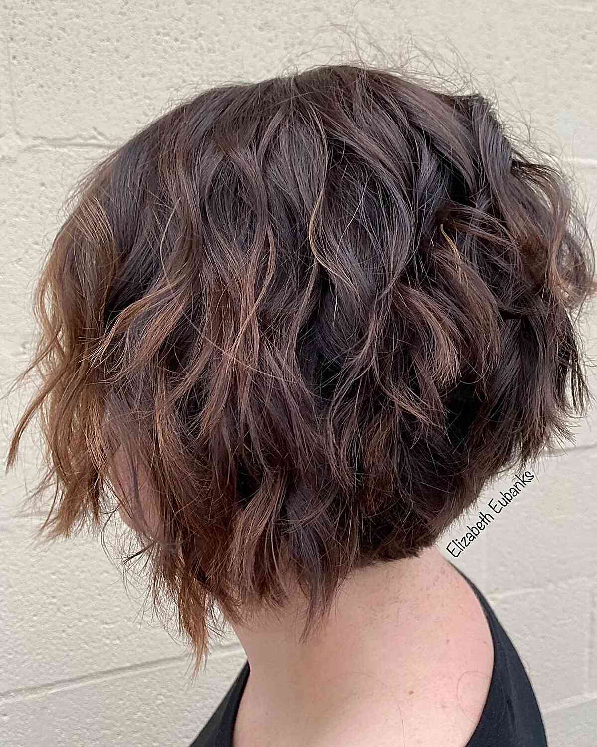 Short Choppy Angled Bob with Graduated Layers and Beach Waves