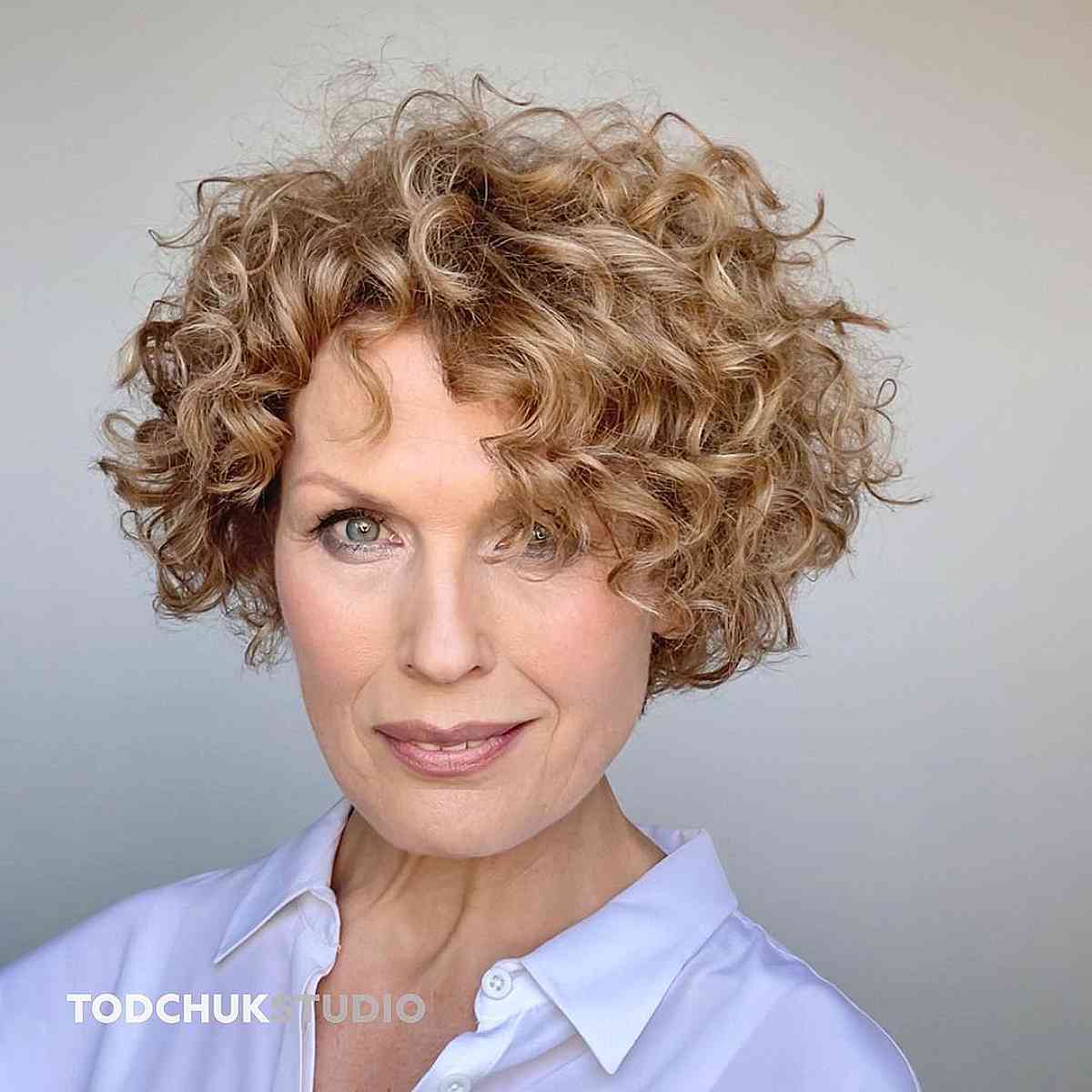Short curly bob style for women over 50 years old