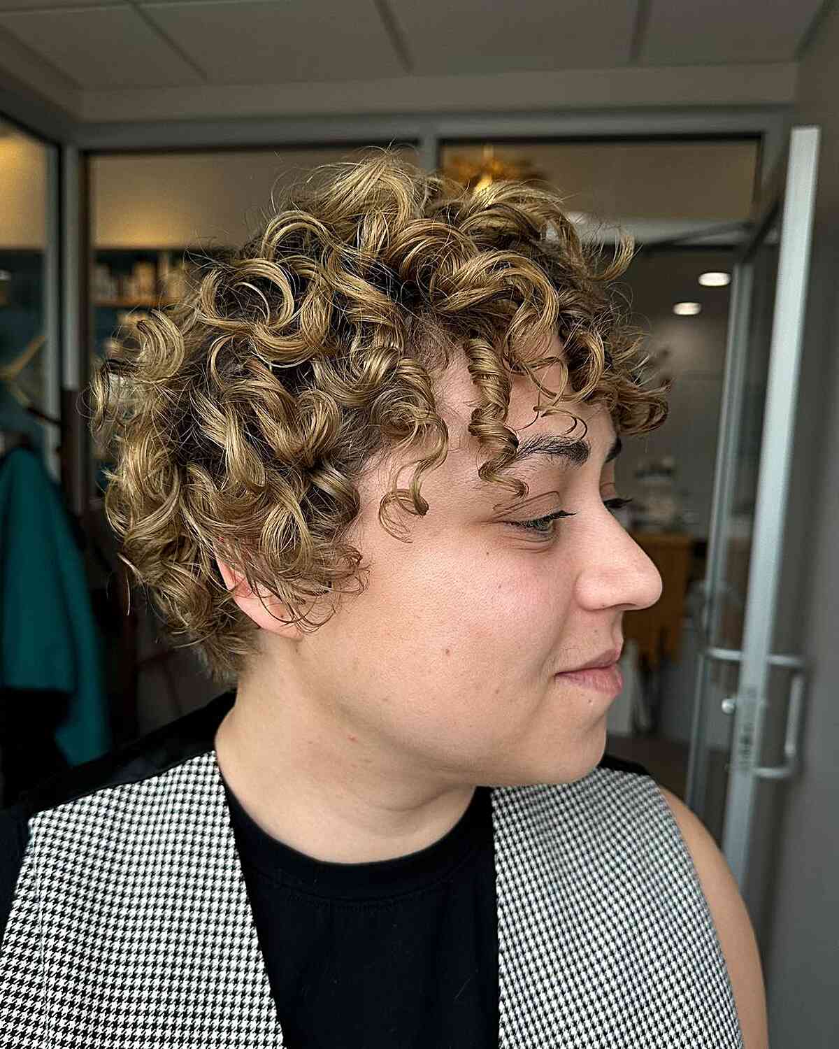 Ear-Length Curly Hair Blonde Balayage with Curly Fringe