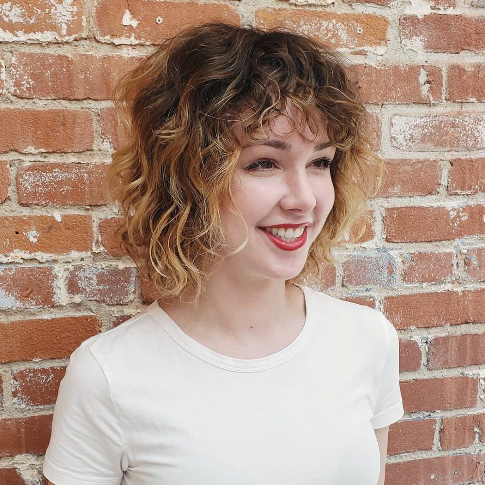 22 Best Short Curly Hair with Bangs to Try This Year