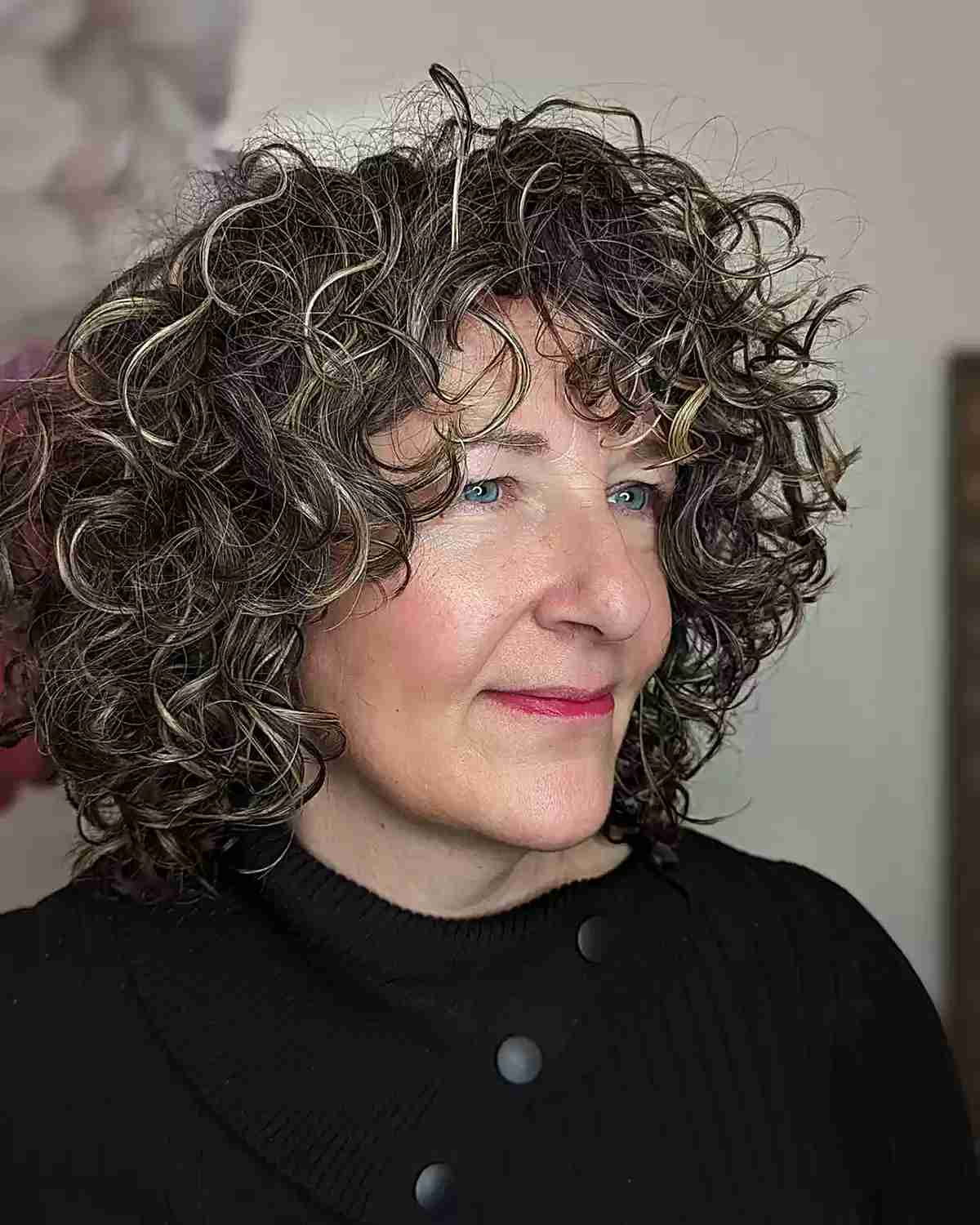 Short Curly Hair with Face-Framing Layers for women aged 60