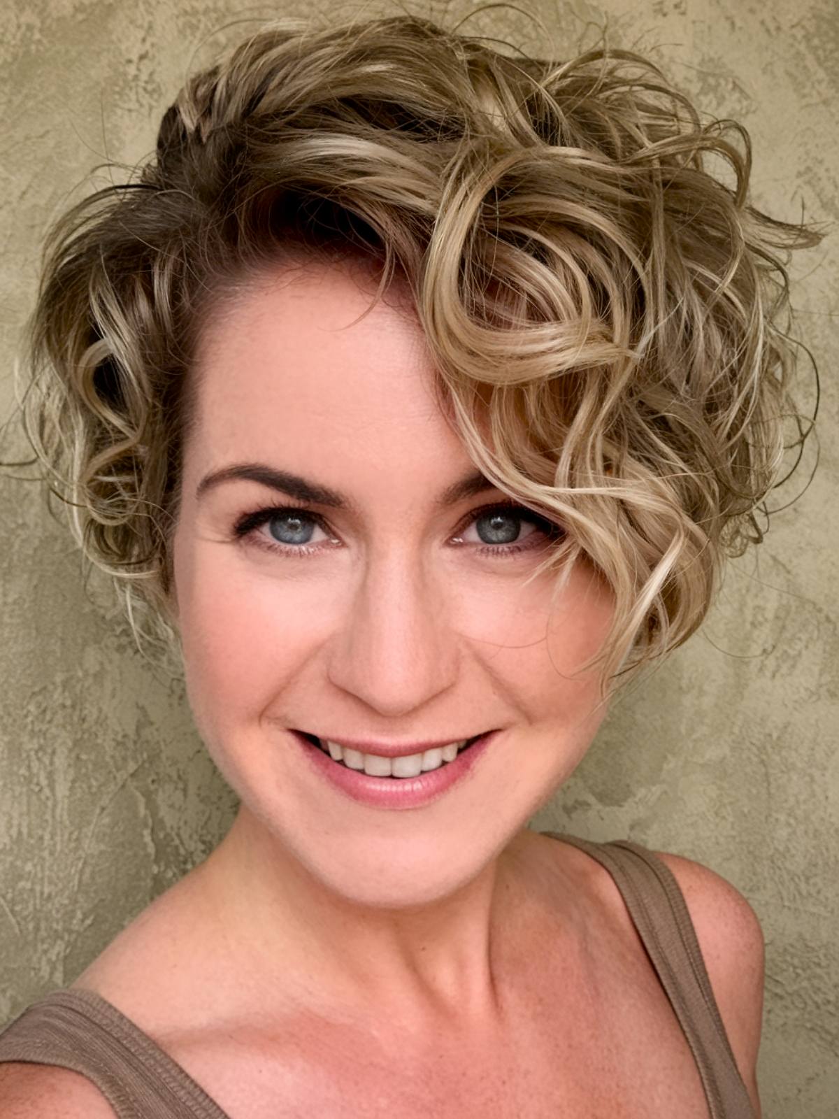 asymmetrical short curly haircut