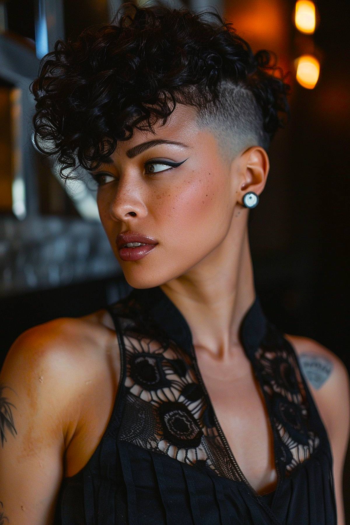 Bold pixie cut with undercut and curly top