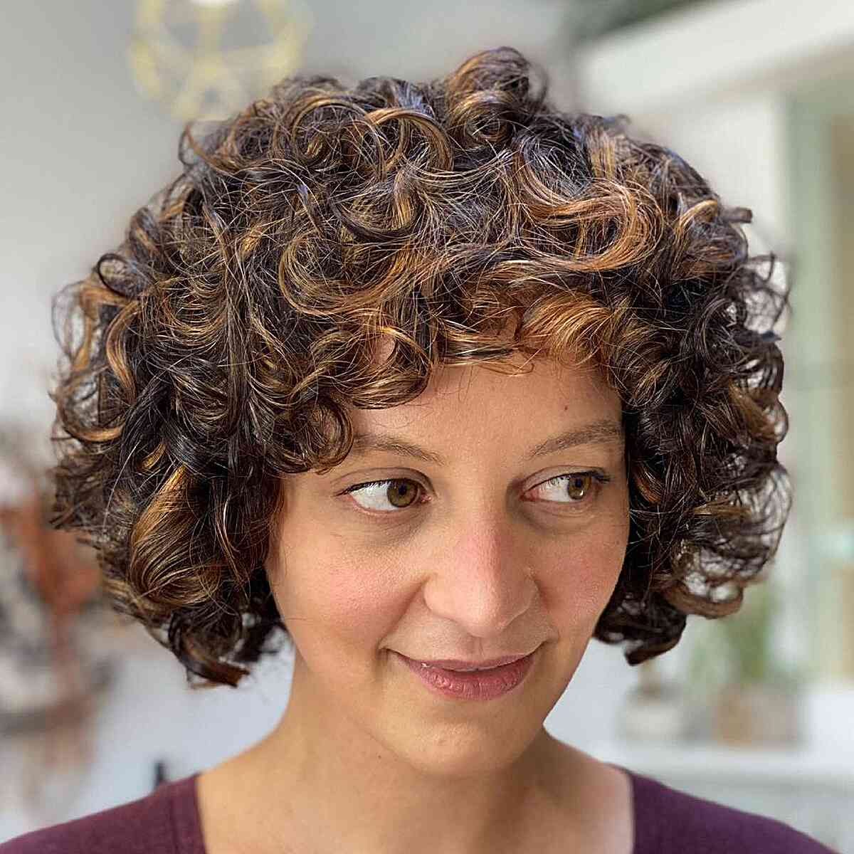Short Curly Rezo Cut Bob Style for women with thick curls and a longer face