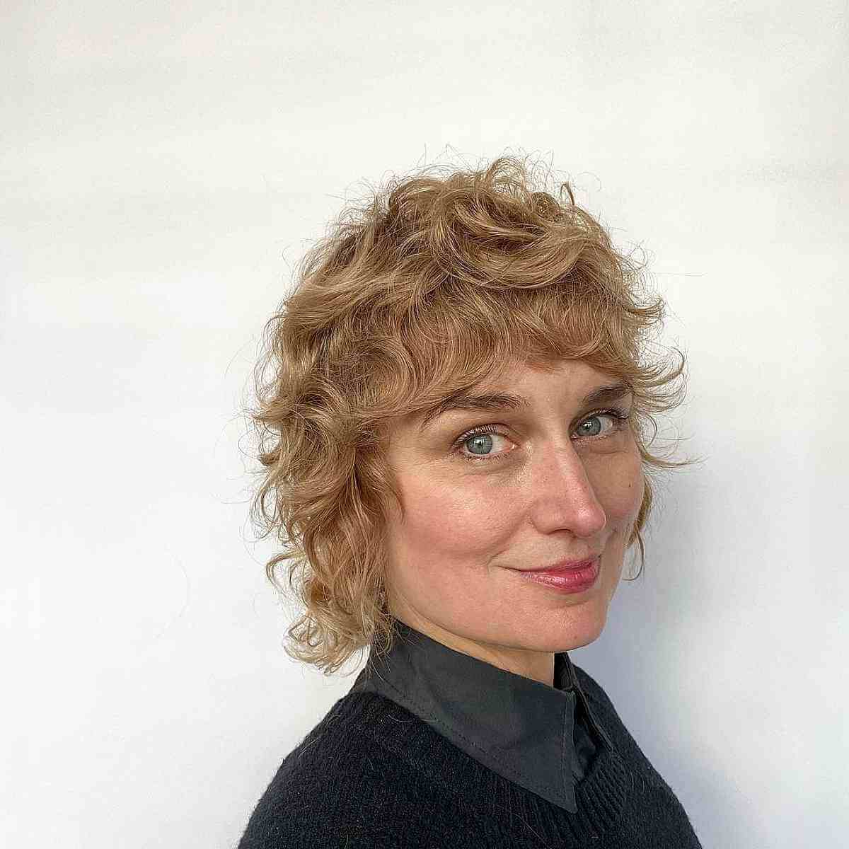 Short Curly Shag Hair with Razored Layers and Fringe for Square Faces