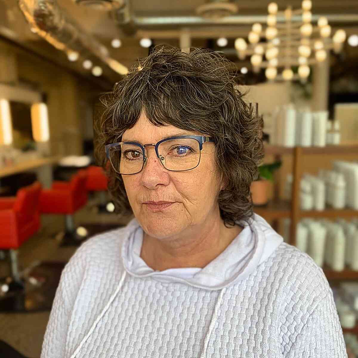 Short Curly Shag with Middle Part Bangs for Senior Women with Glasses