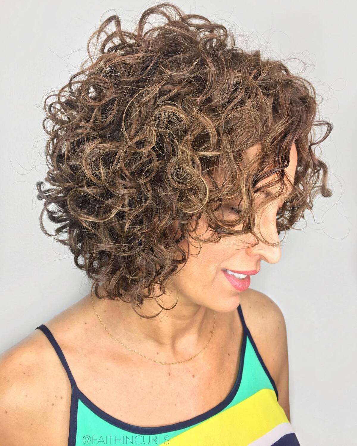 Short Curly Stacked Bob with Bangs