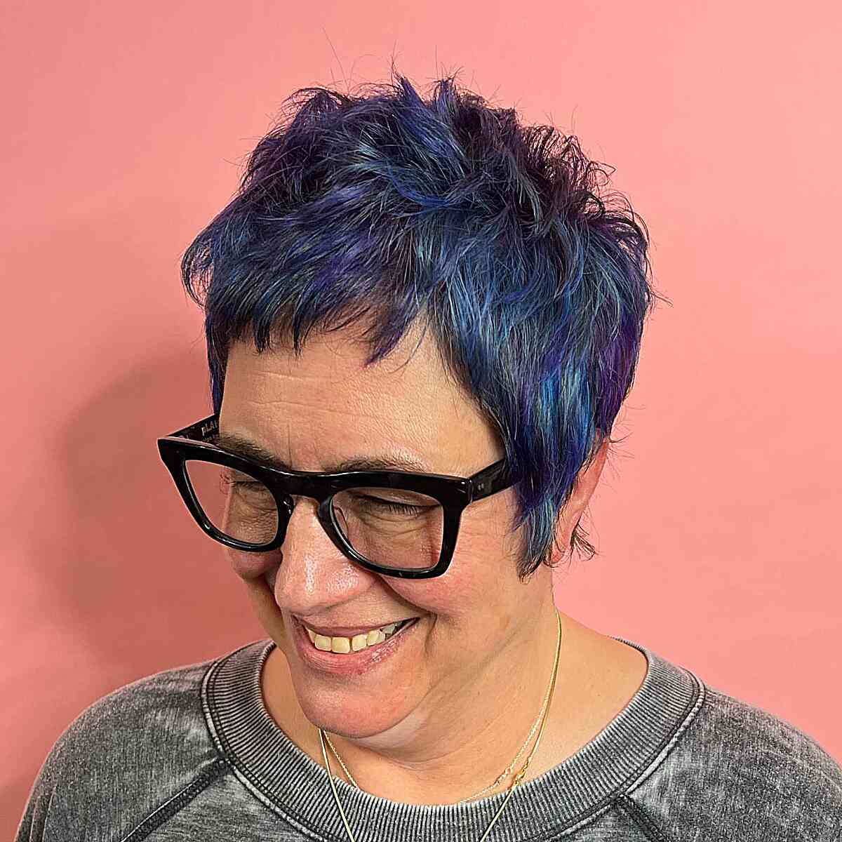 Short Edgy Hair with Blue-Purple Tones on Ladies Over 60 Wearing Glasses