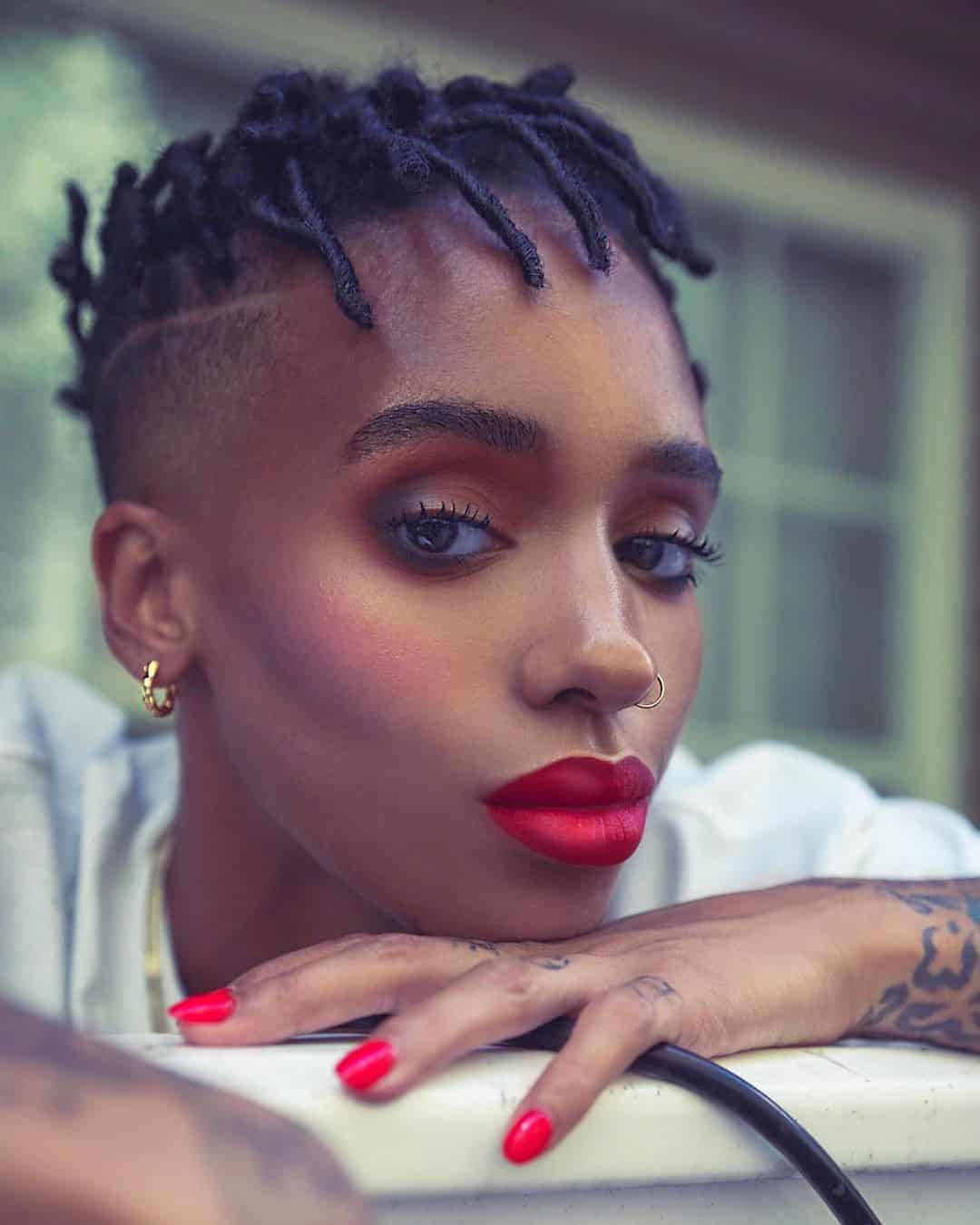 short faux locs with shaved sides