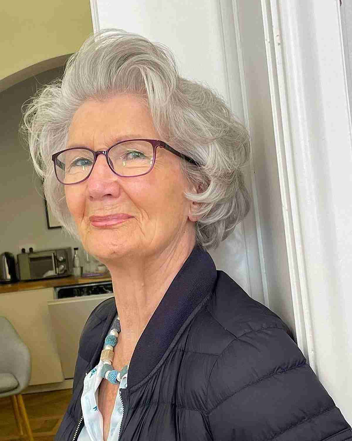Short Feathered Cut for Wavy Hair with Glasses for 70-Year-Olds