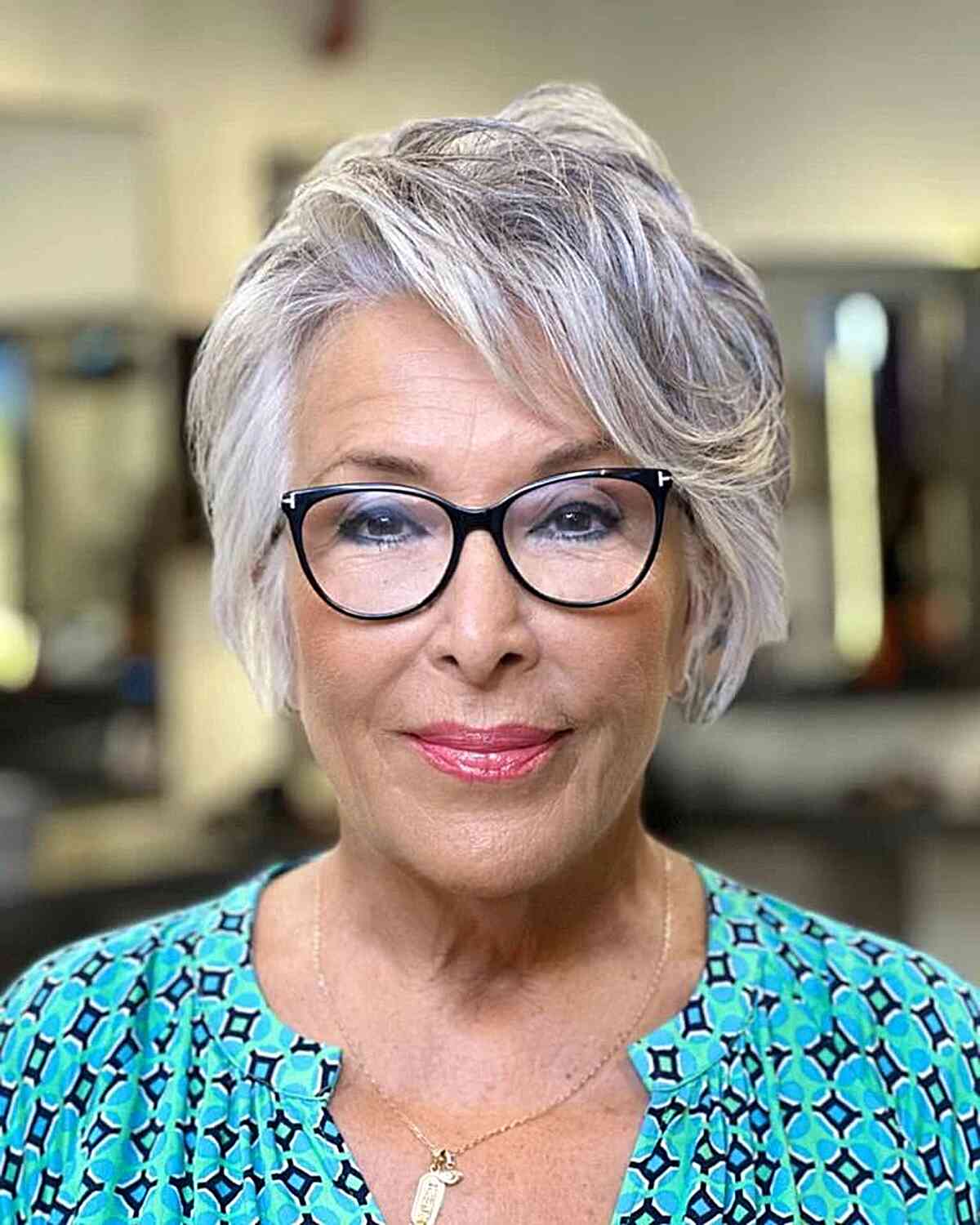 Short Feathered Gray Hairstyle with Swept Bangs for 60-year-olds