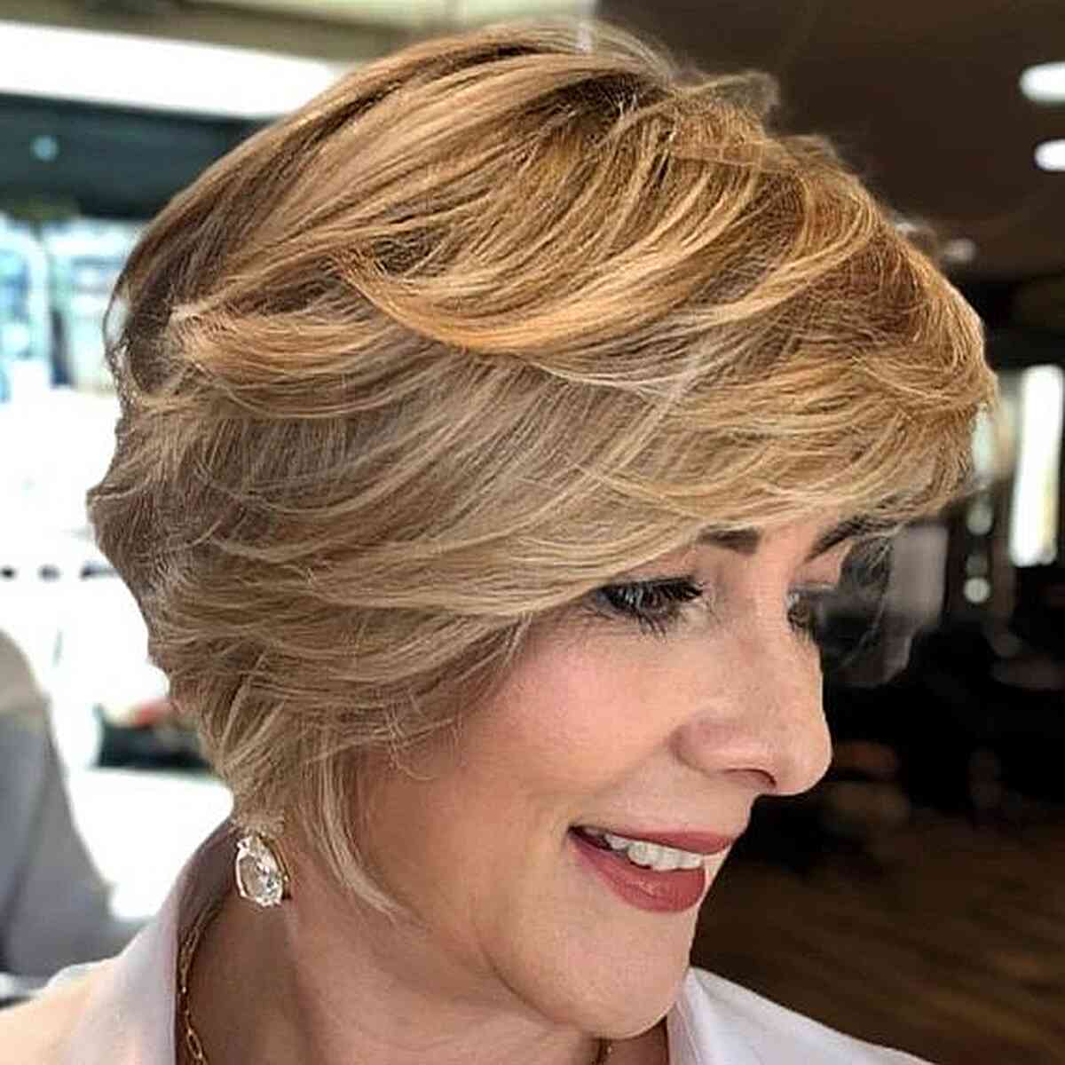 Short Golden Blonde Feathered Layers on a bob cut for women over 50