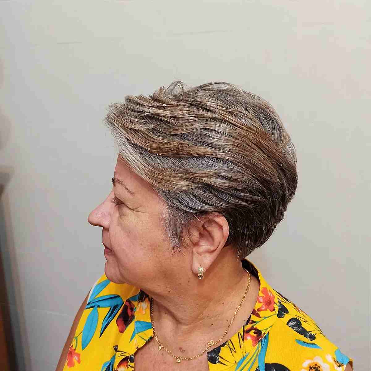 Casual Short Graduated Pixie Haircut with Highlights for a 60-Year-Old