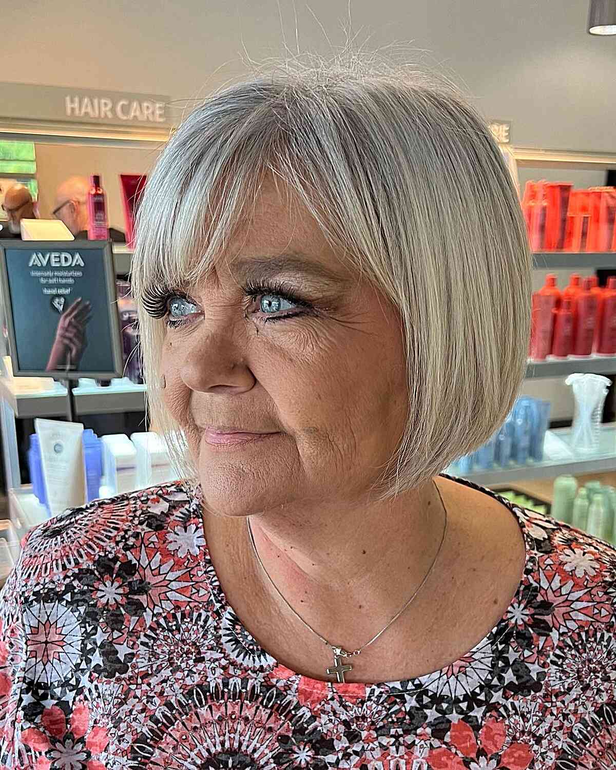 Short Gray Bobbed Hair with Side Part and Bangs for Women Aged 70 and Up