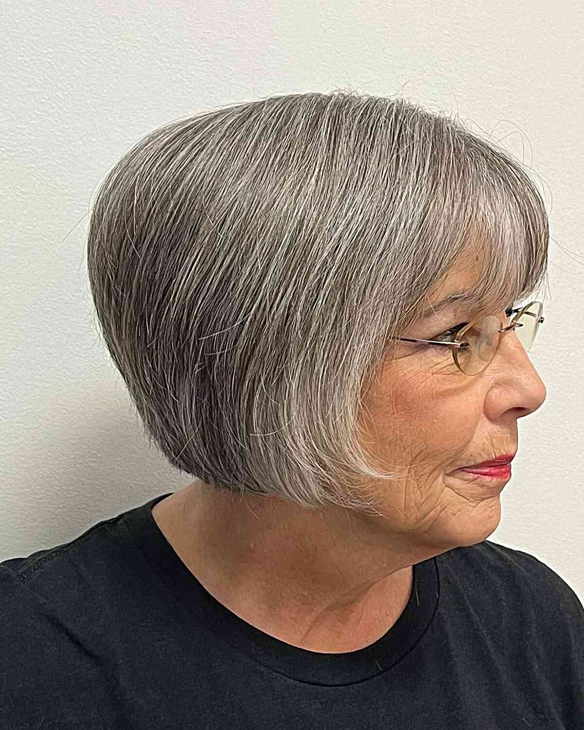 Short great hairstyle for women over 60 with glasses