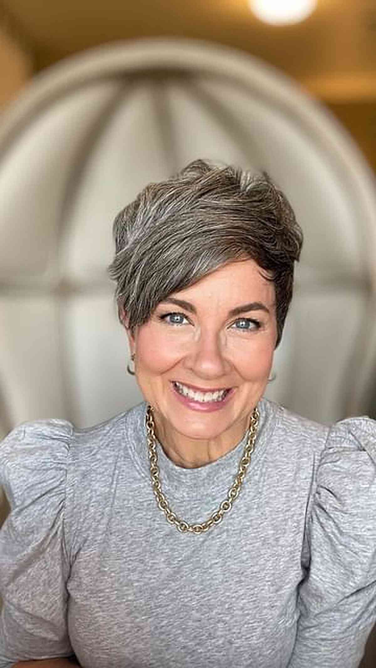 Short Grey Pixie Cut with Swept Fringe for 60-Year-Olds
