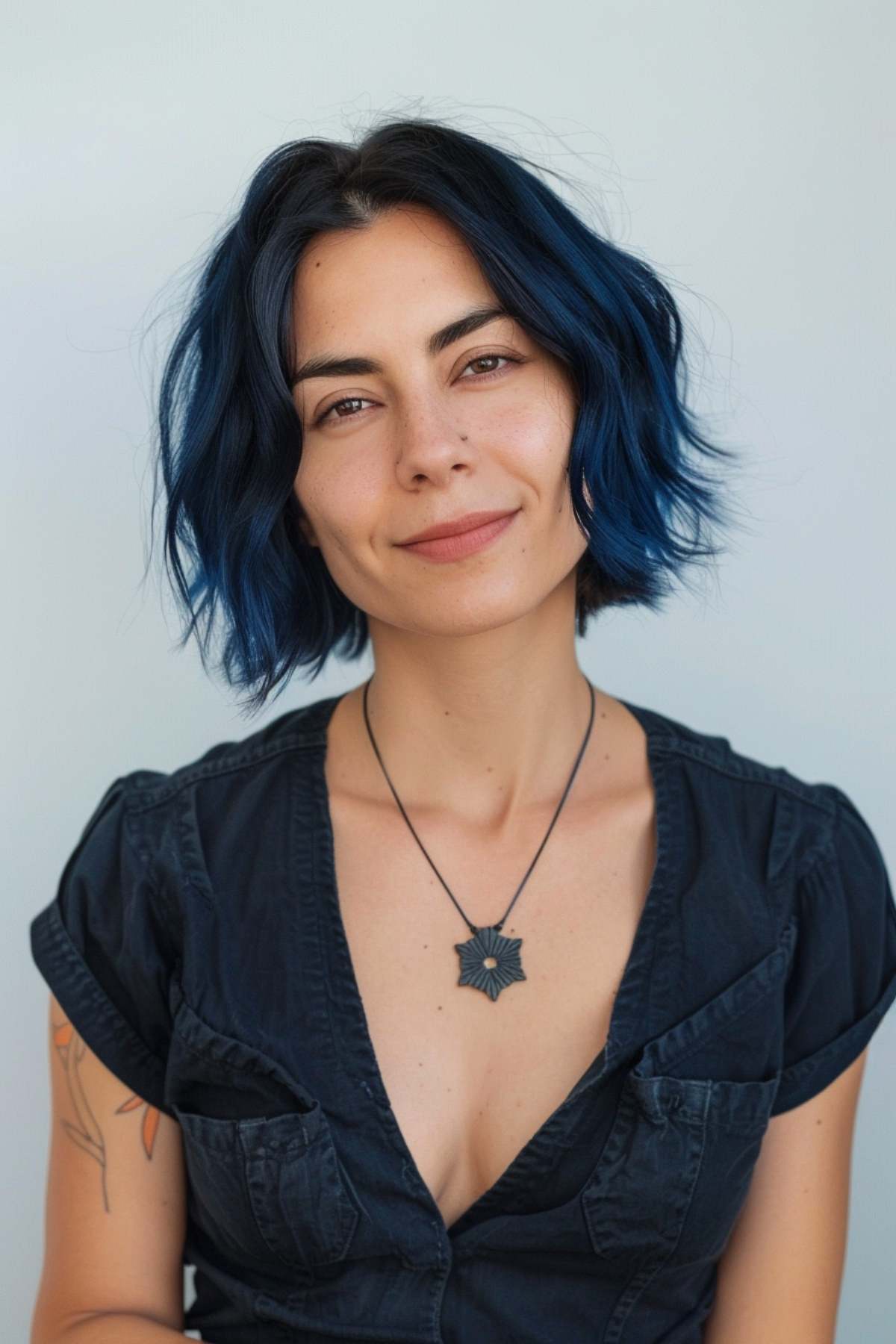 Short hair with blue highlights and subtle waves