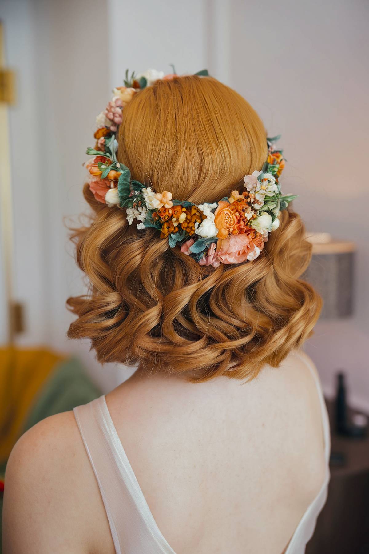 Short curls with flower crown for wedding