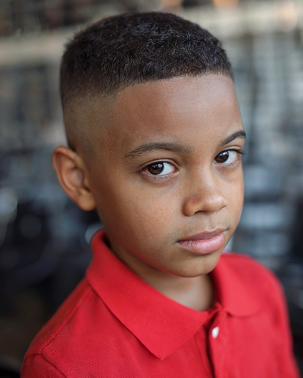 Boys taper fade haircut with clean line up for sharp edges