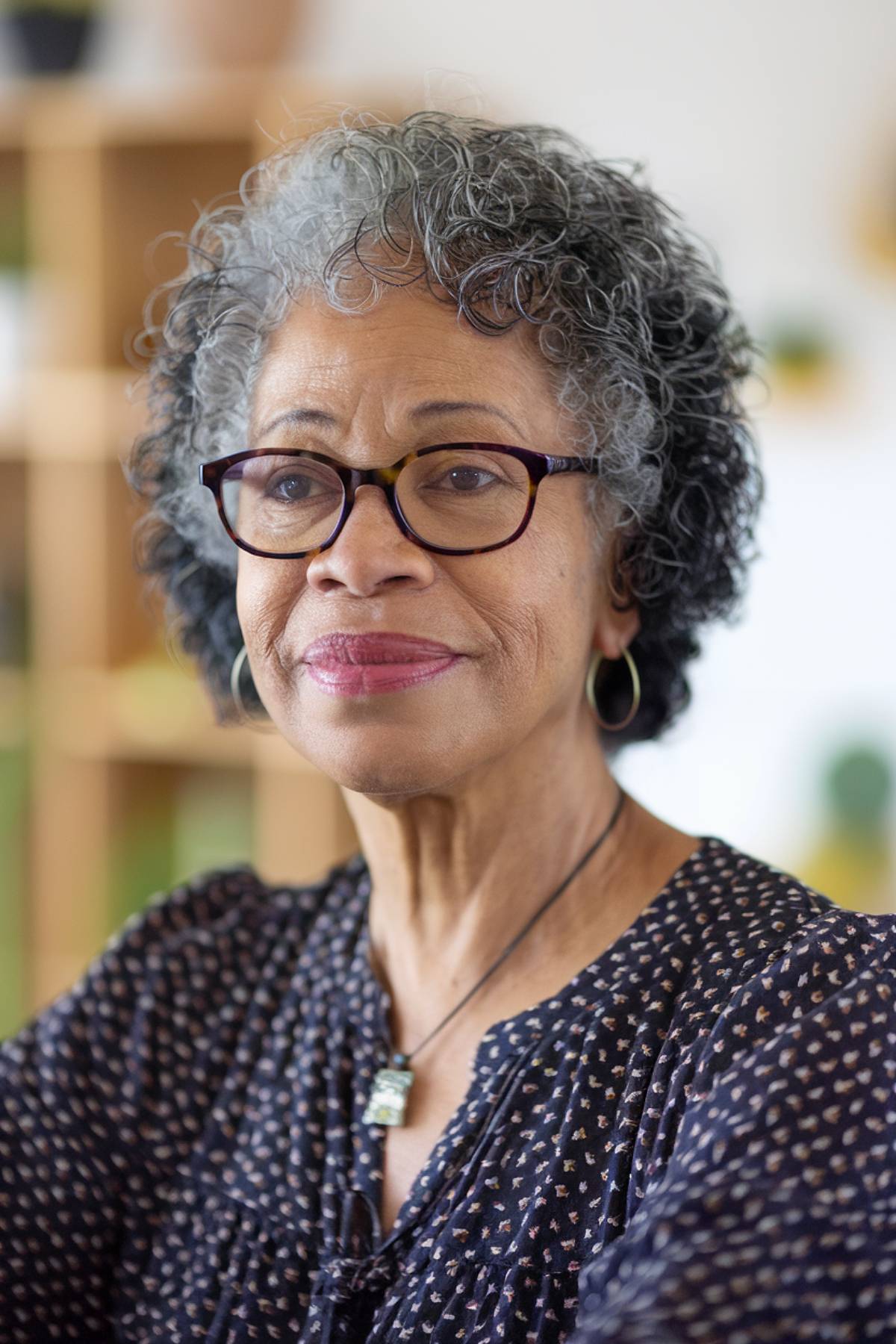 Short hairstyle for black women over 60 with glasses