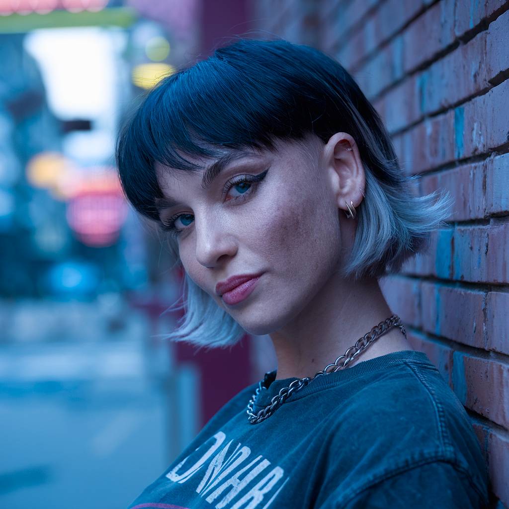 Edgy short mullet with choppy layers and an ombre effect for a bold, punk-inspired look