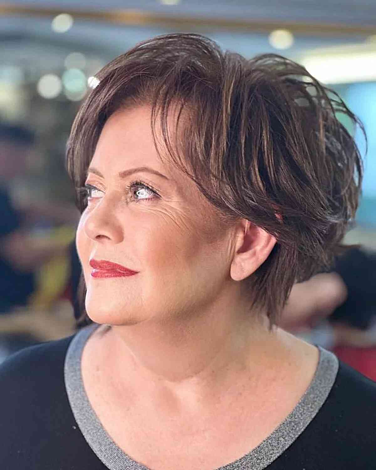 Short, Heavily Layered Hairstyle for 50-year-olds with Round Faces