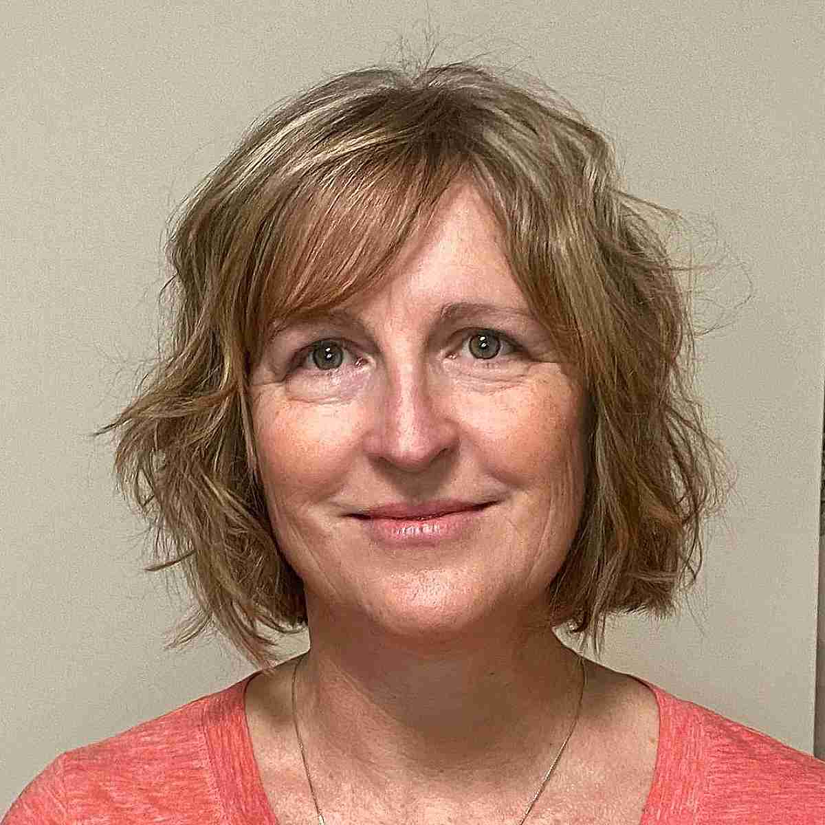 Short Honey Blonde Hair with Tousled Layers for 50-Year-Old Women