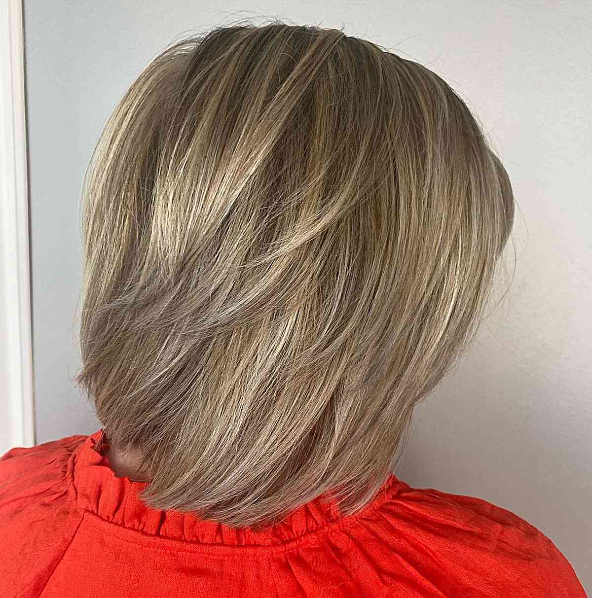 Short Layered Blonde Butterfly Bob Cut with Shorter Pieces