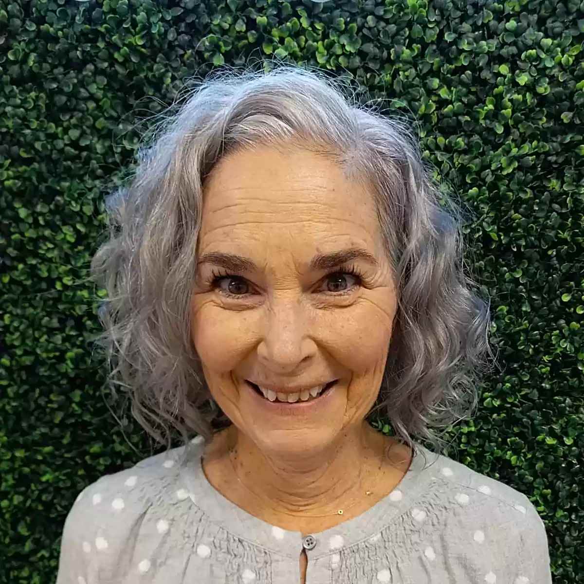 Short Layered Grey Curls with Deep Side Part on Senior Ladies