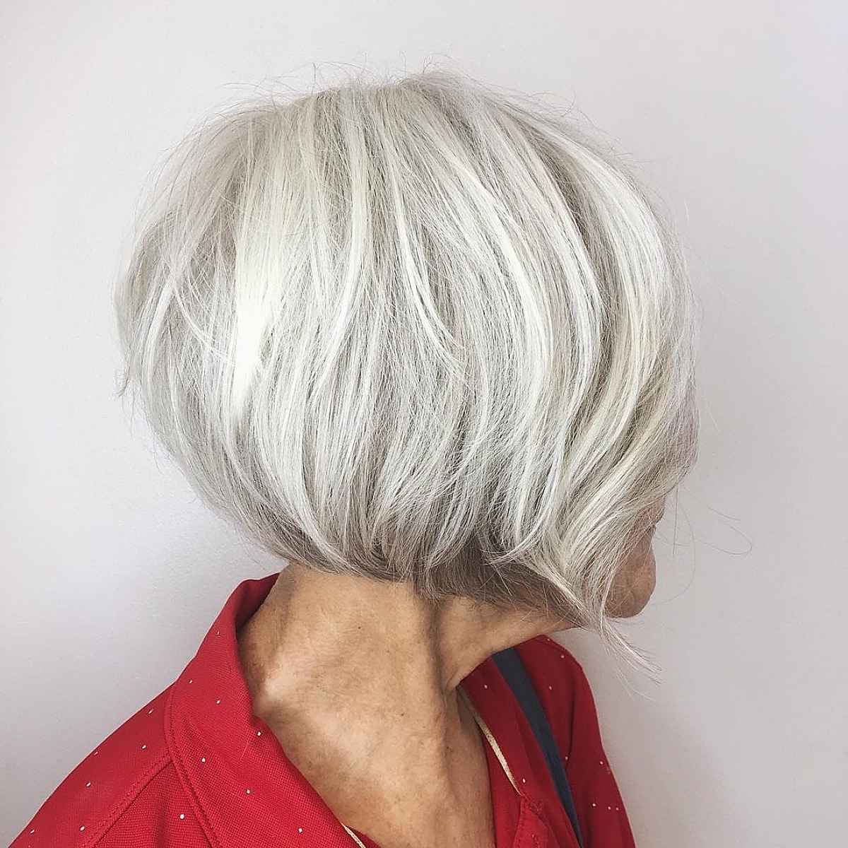 Short layered hairstyle for ladies over 60 with grey thick hair