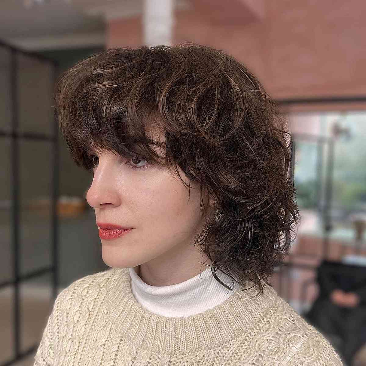 Short Layered Shag with Bangs for Oval Faces with Thick Wavy Hair
