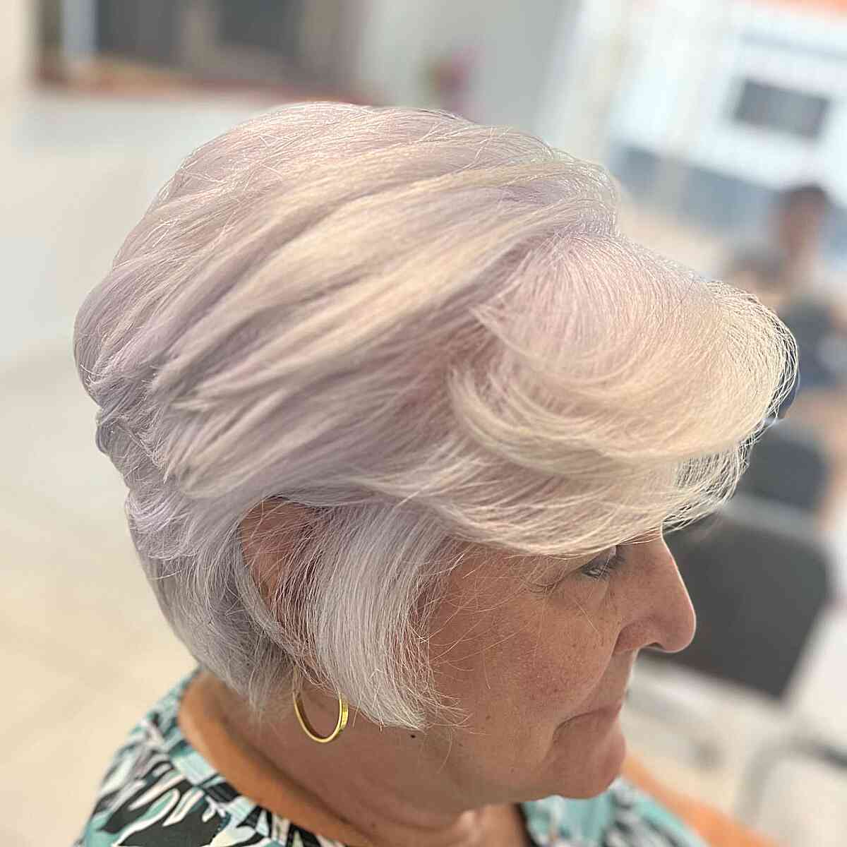 Short Layered White Feathered Lixie with Swoopy Bangs for 60-year-olds