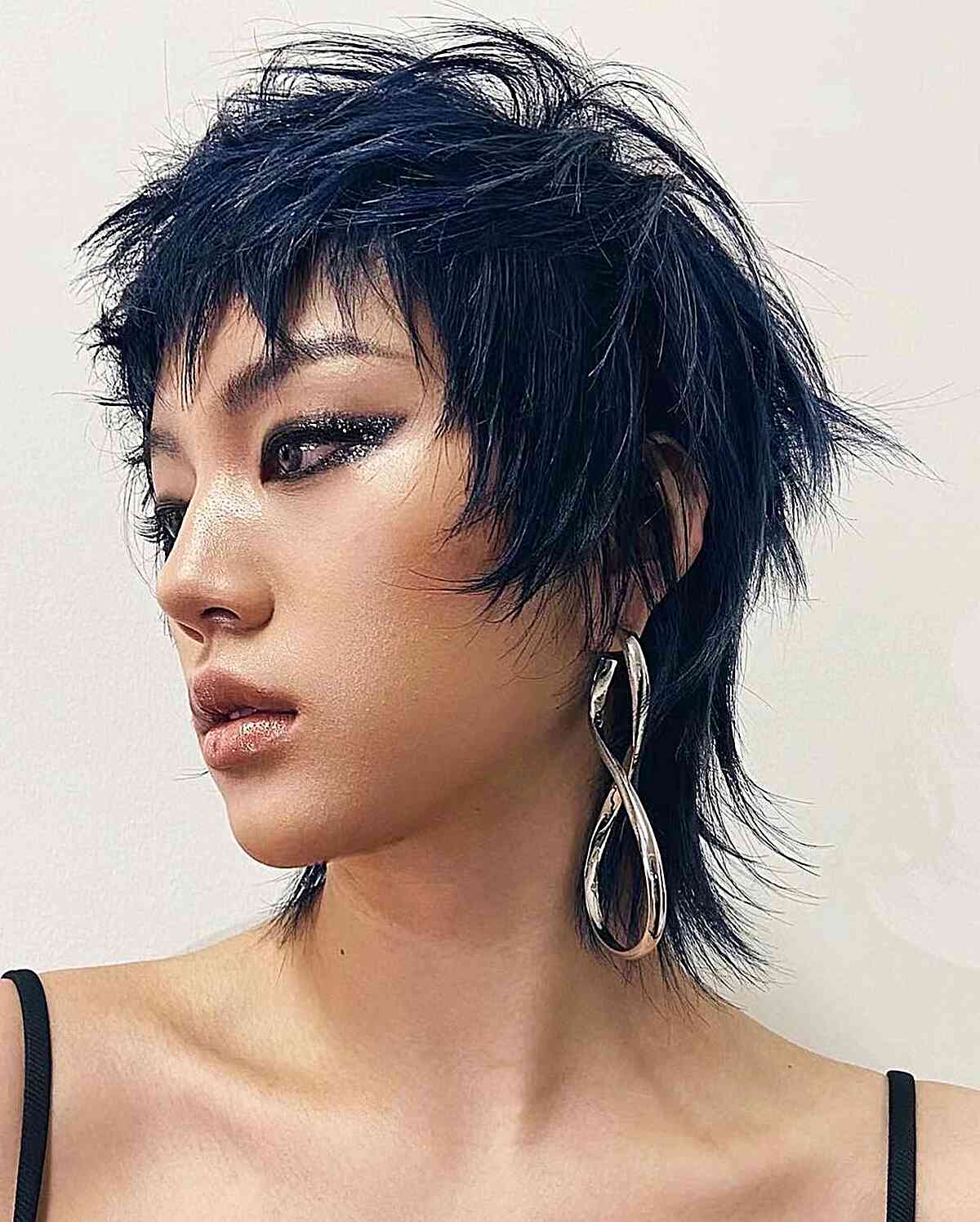 Short-Length Mullet with Messy Layers and Choppy Bangs for Long Faces