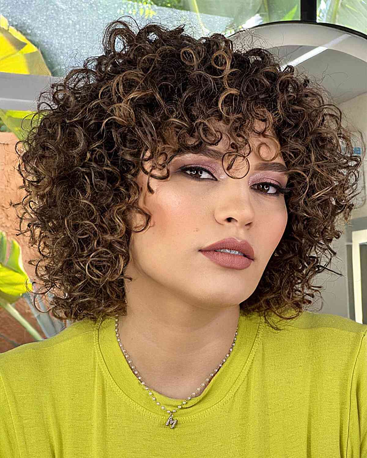 Short Light Curls with Highlights and Bangs