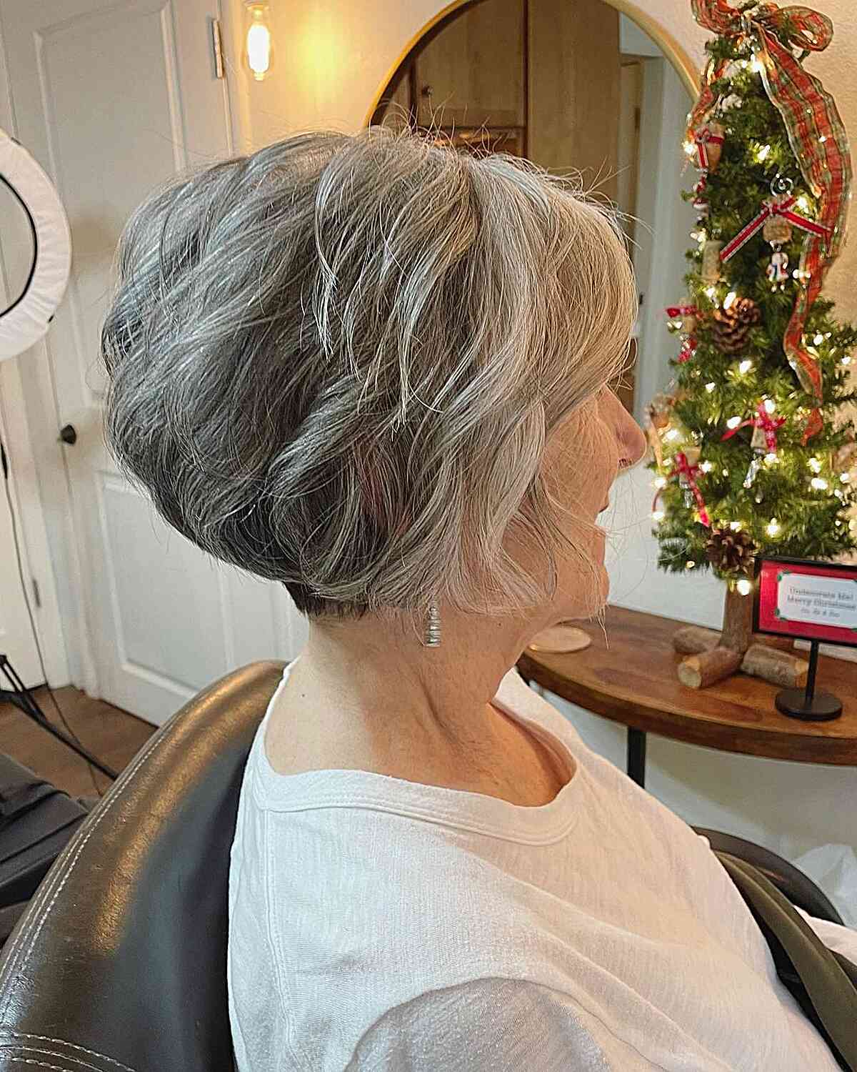 Short Modern Wavy Layered Wedge on Older Women with Gray Hair