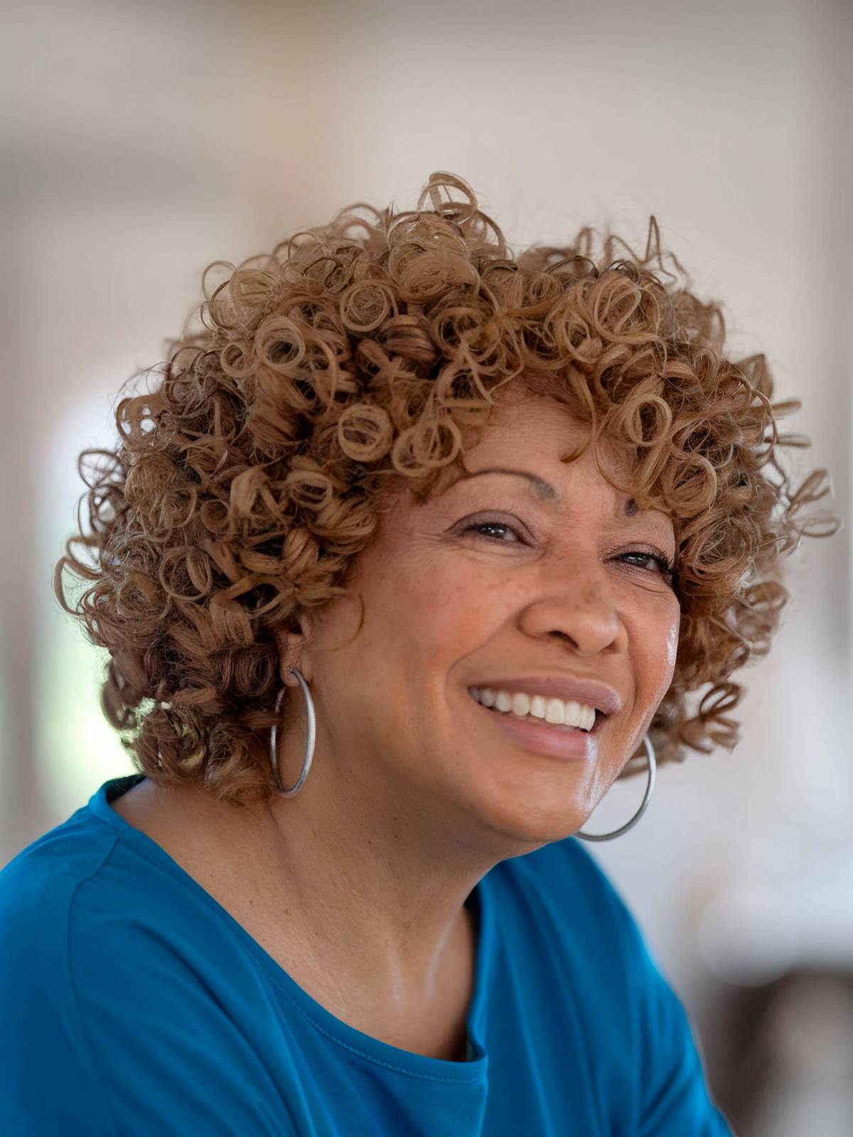 Short natural haircut for black women over 60 with round faces