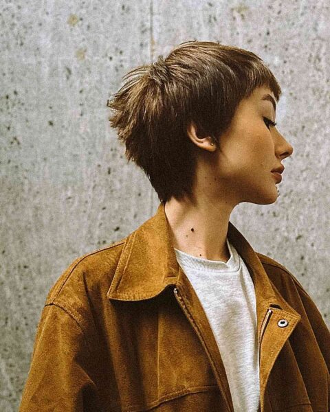 a Short Pixie Crop with Textured Bangs on Dense Hair