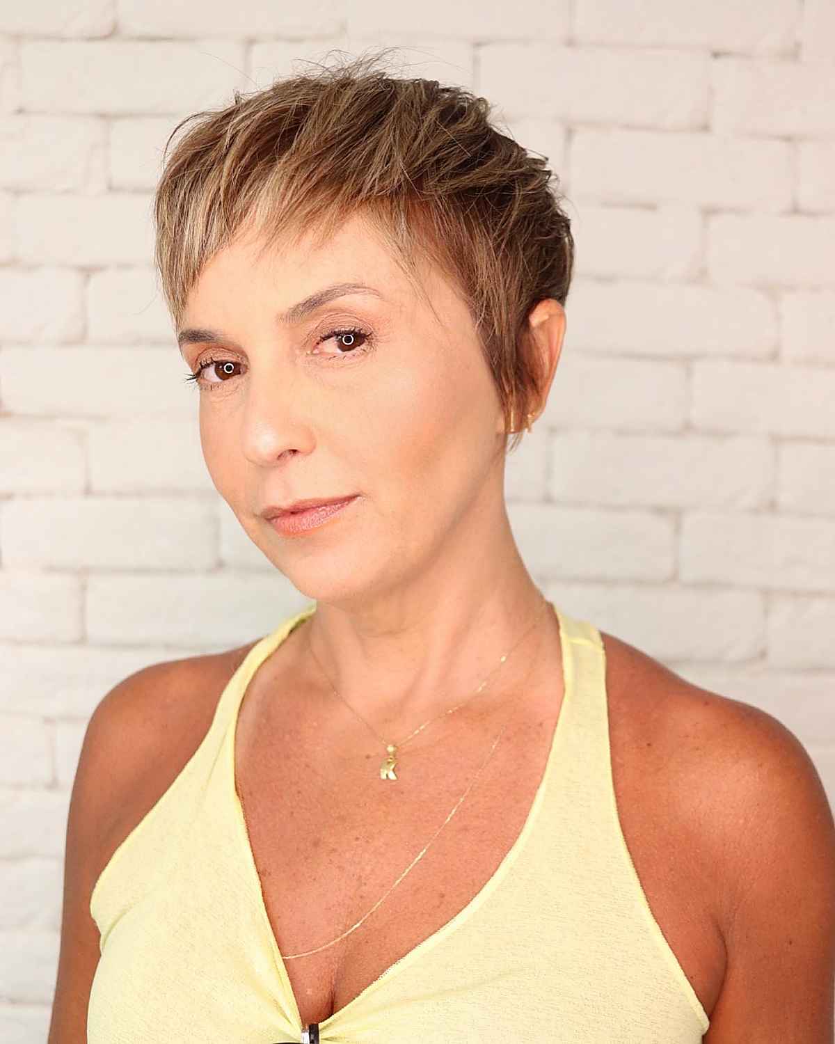 short pixie hairstyle with bangs for women over 40