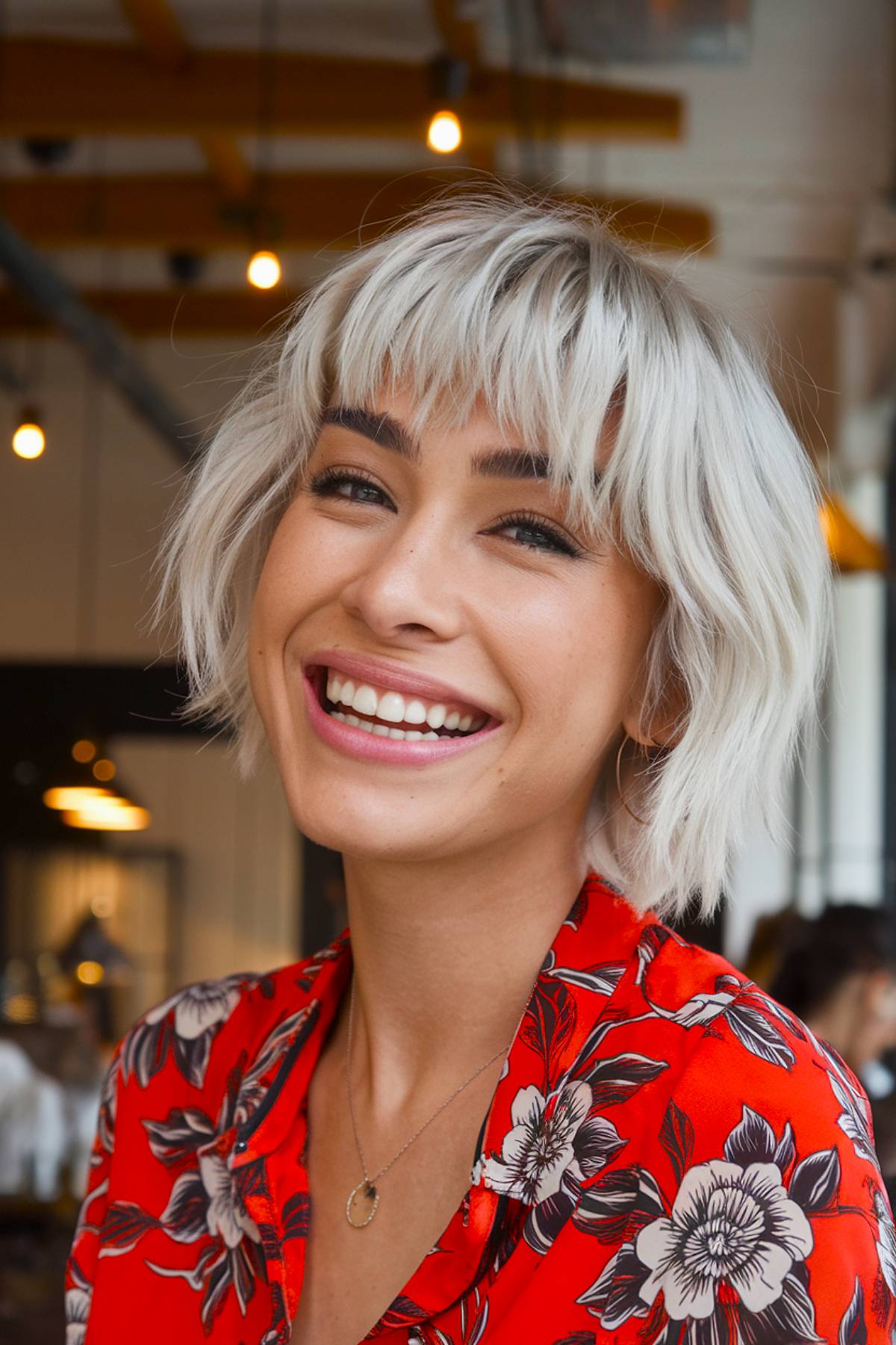 Edgy platinum blonde bob with choppy bangs for a bold, statement-making look