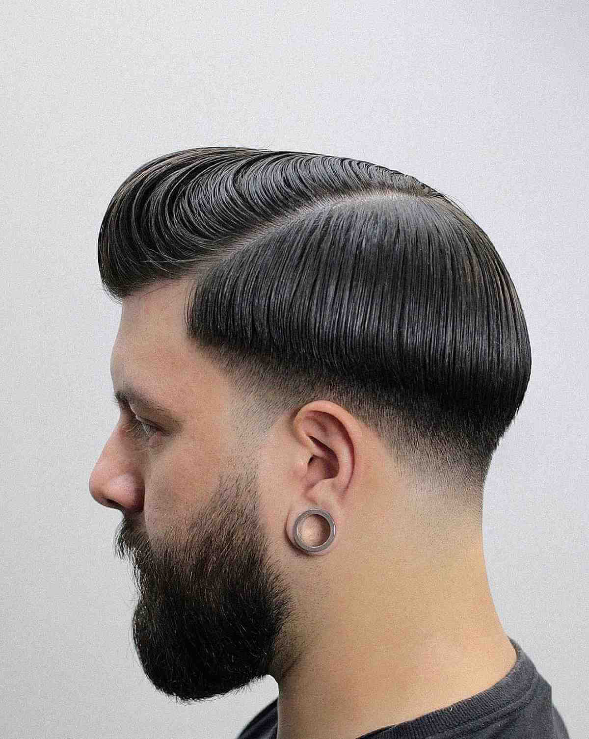 Short Pompadour with a Hard Part and Low Fade
