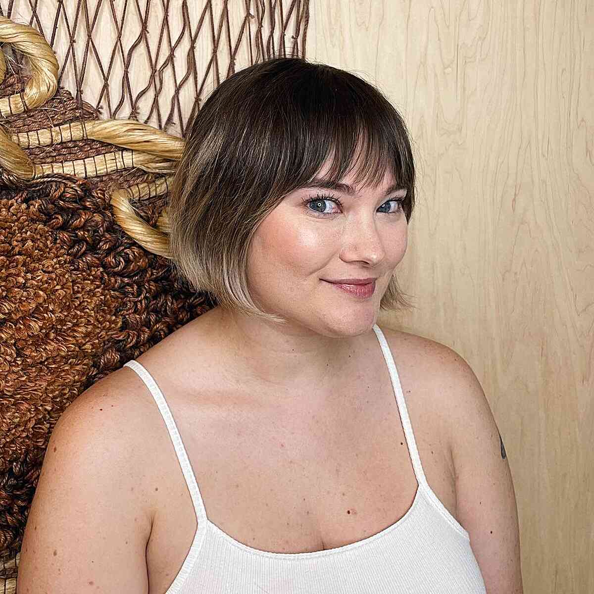 Short Razor Cut Bobbled Hair with Piece-y Bangs for Ladies with Round Faces