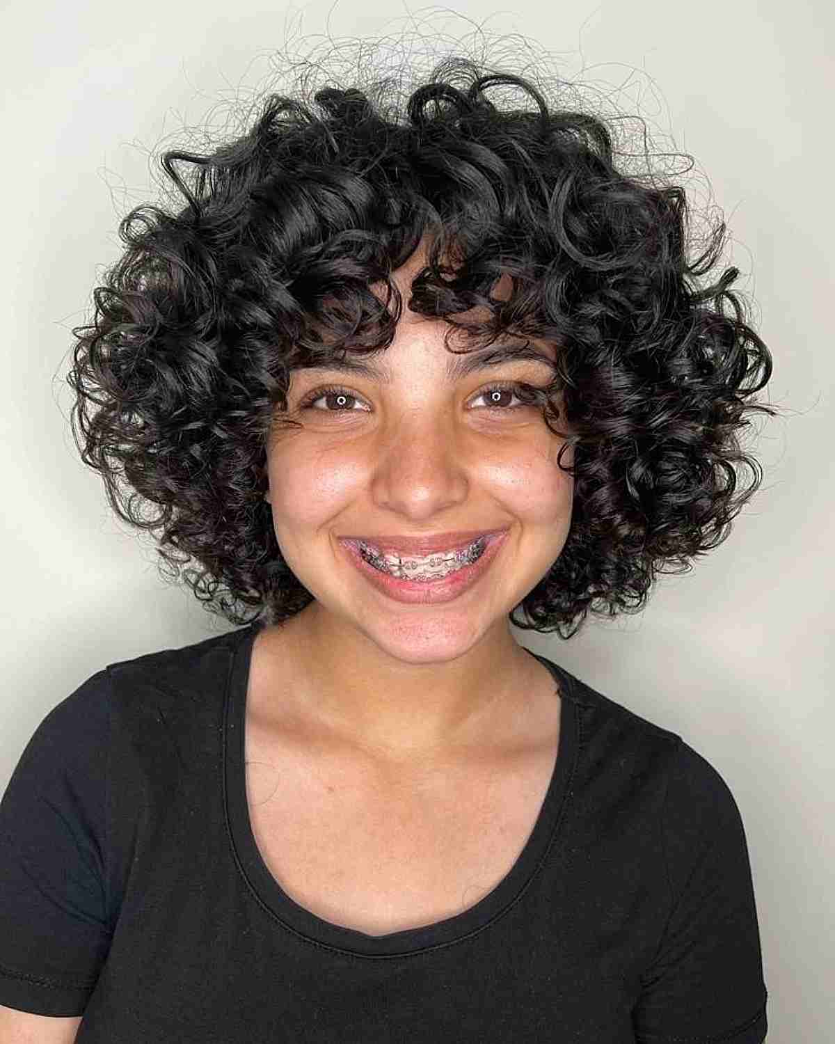 Short Round-Shaped Layered Bob with Bouncy Curls